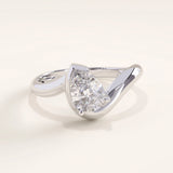 Silver vermeil wavy pear ring with a pear-shaped cubic zirconia centerpiece in a modern wave-style setting, sleek and sophisticated jewelry piece.
