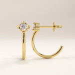 14k gold vermeil solo hoop earrings featuring a refined half-hoop silhouette accented with a brilliant round cubic zirconia in a modern prong setting for effortless sparkle.
