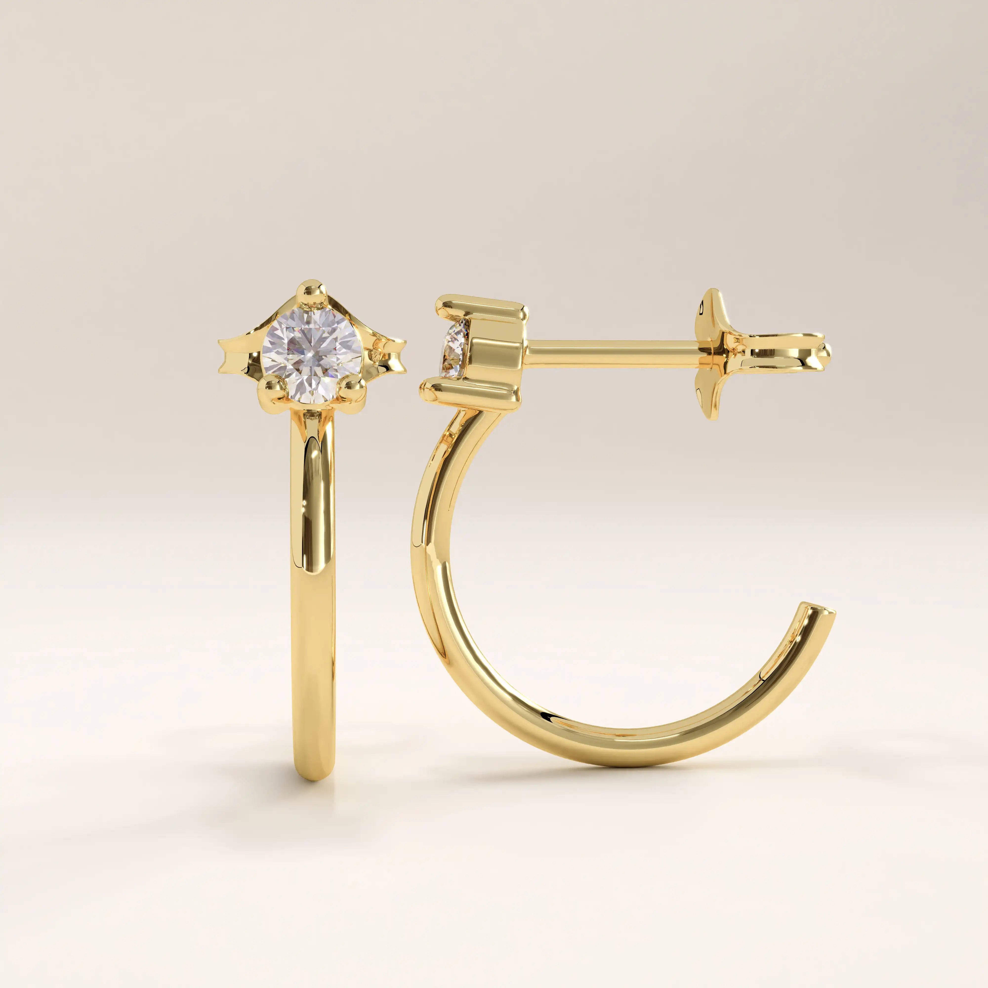 14k gold vermeil solo hoop earrings featuring a refined half-hoop silhouette accented with a brilliant round cubic zirconia in a modern prong setting for effortless sparkle.
