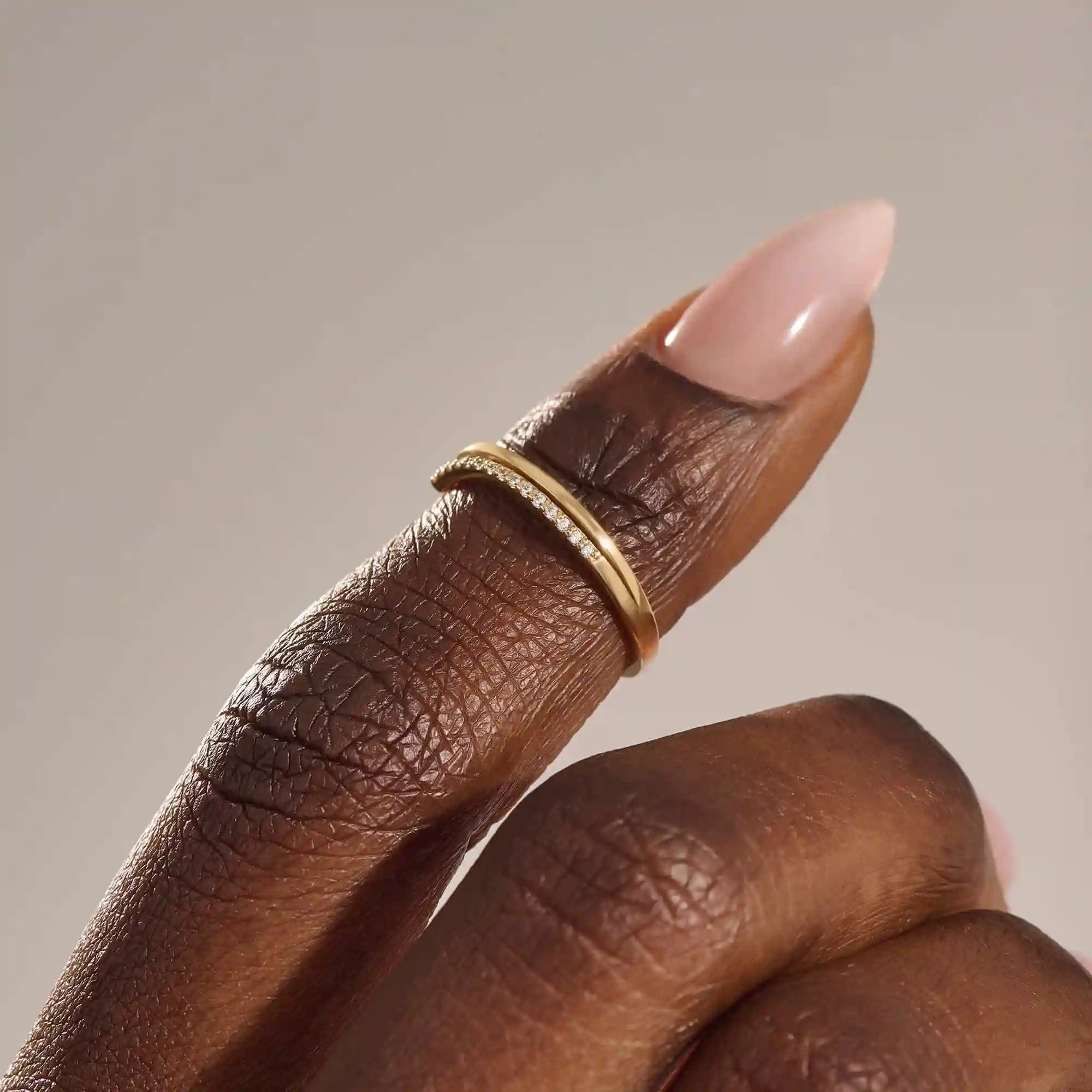 This split band ring The band is adorned with sparkling stones unique split design modern 14k solid yellow gold stacking wedding ring