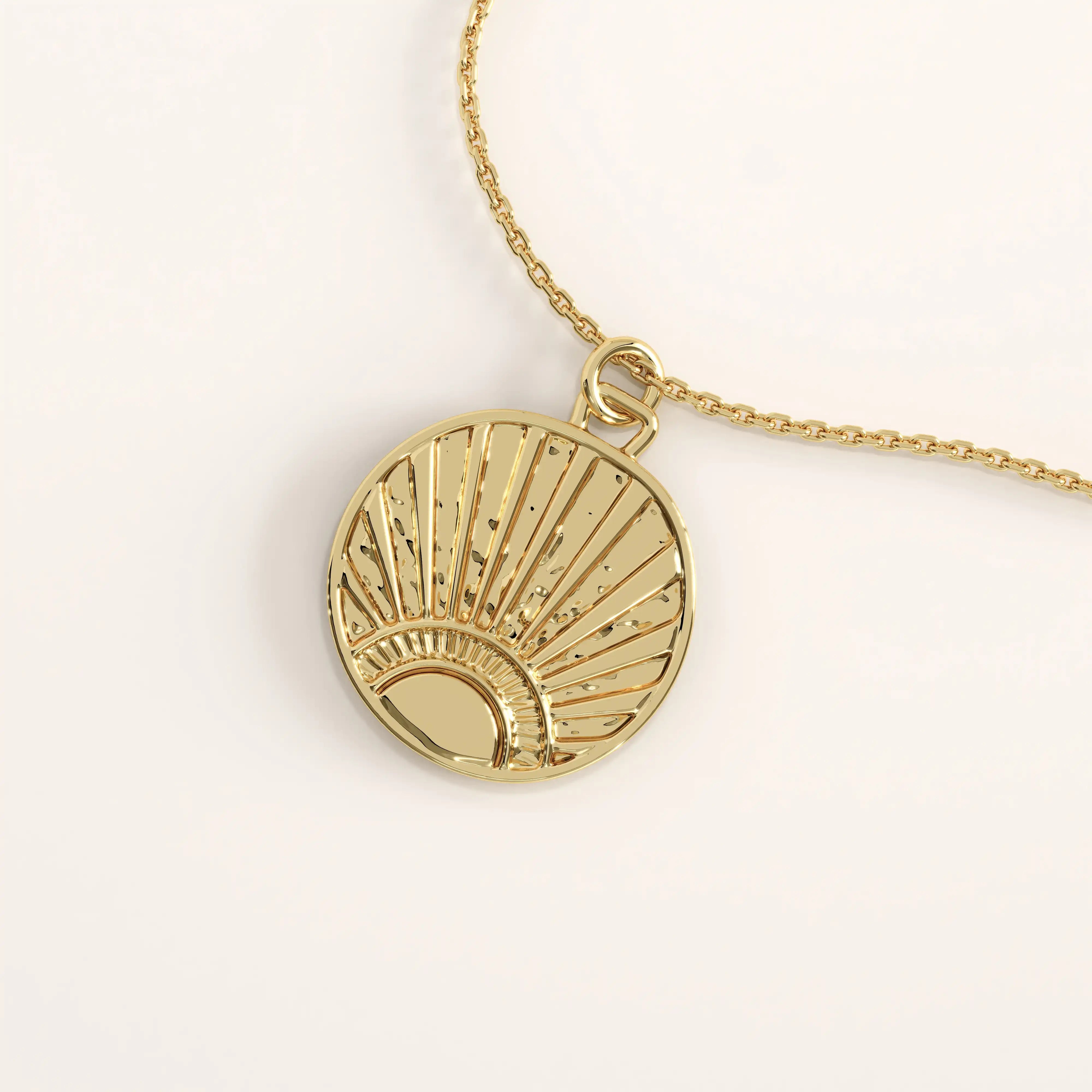 14k gold vermeil sunrise coin necklace featuring a round pendant with a radiant sun motif and hammered detailing that captures light beautifully for a warm, elegant glow.
