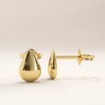 14k gold vermeil teardrop stud earrings featuring a smooth, high-polish finish in an elegant droplet shape, perfect for a minimalist and timeless look.
