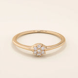 slim design and a cluster of small round moissanite stones promise engagement ring in 14k solid gold for women